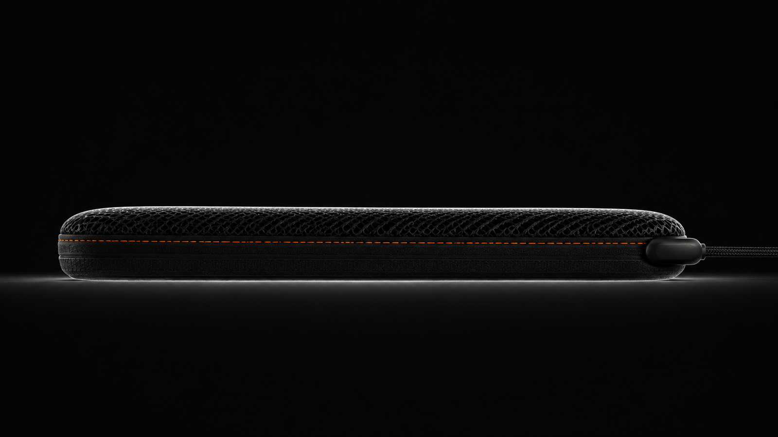 Dead level side profile of the cushion showing how thin it sits, with the duct exiting the rear edge