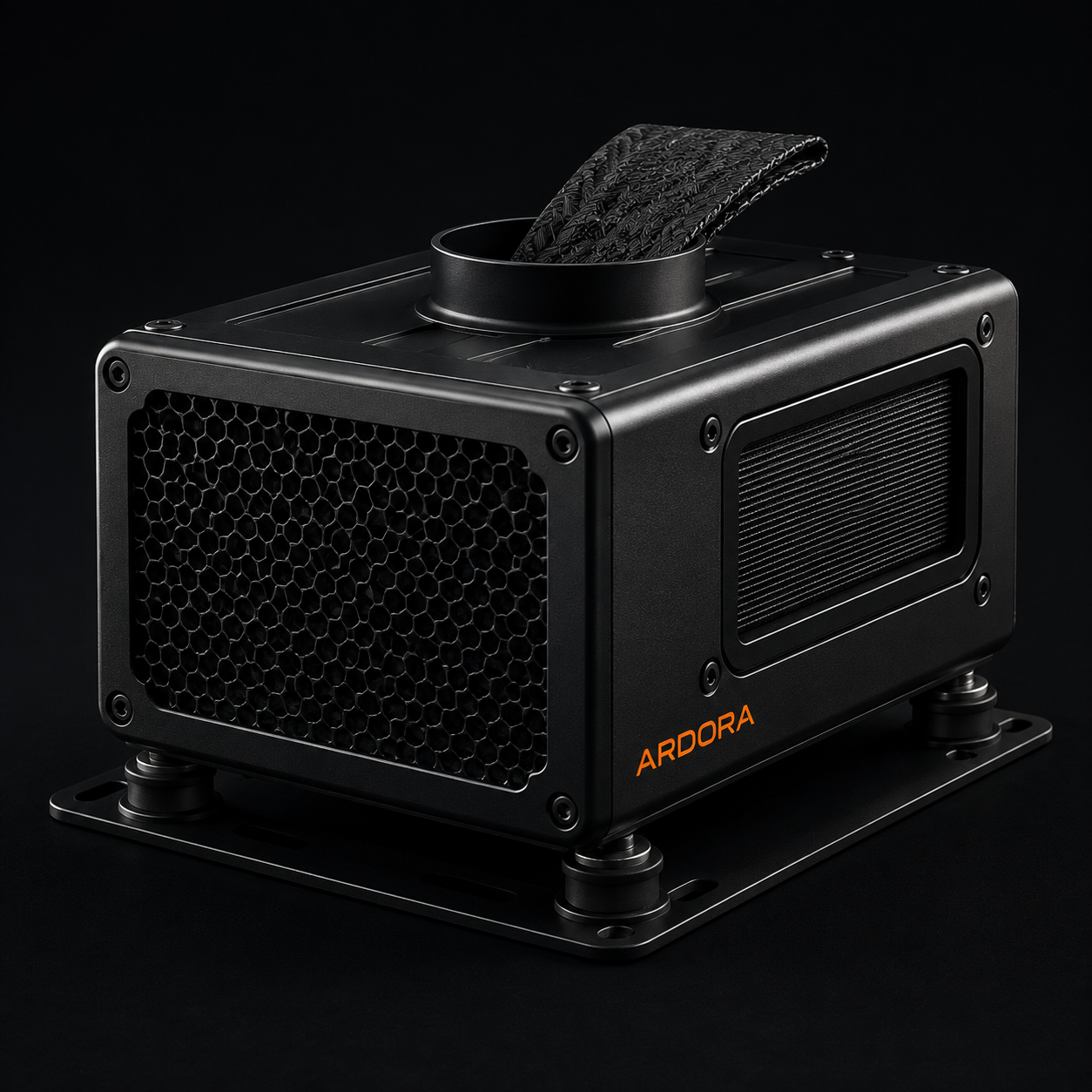 The under seat cooling module showing the hex mesh exhaust face, the finned heat exchanger, the duct collar and vibration isolating feet on its strap mount