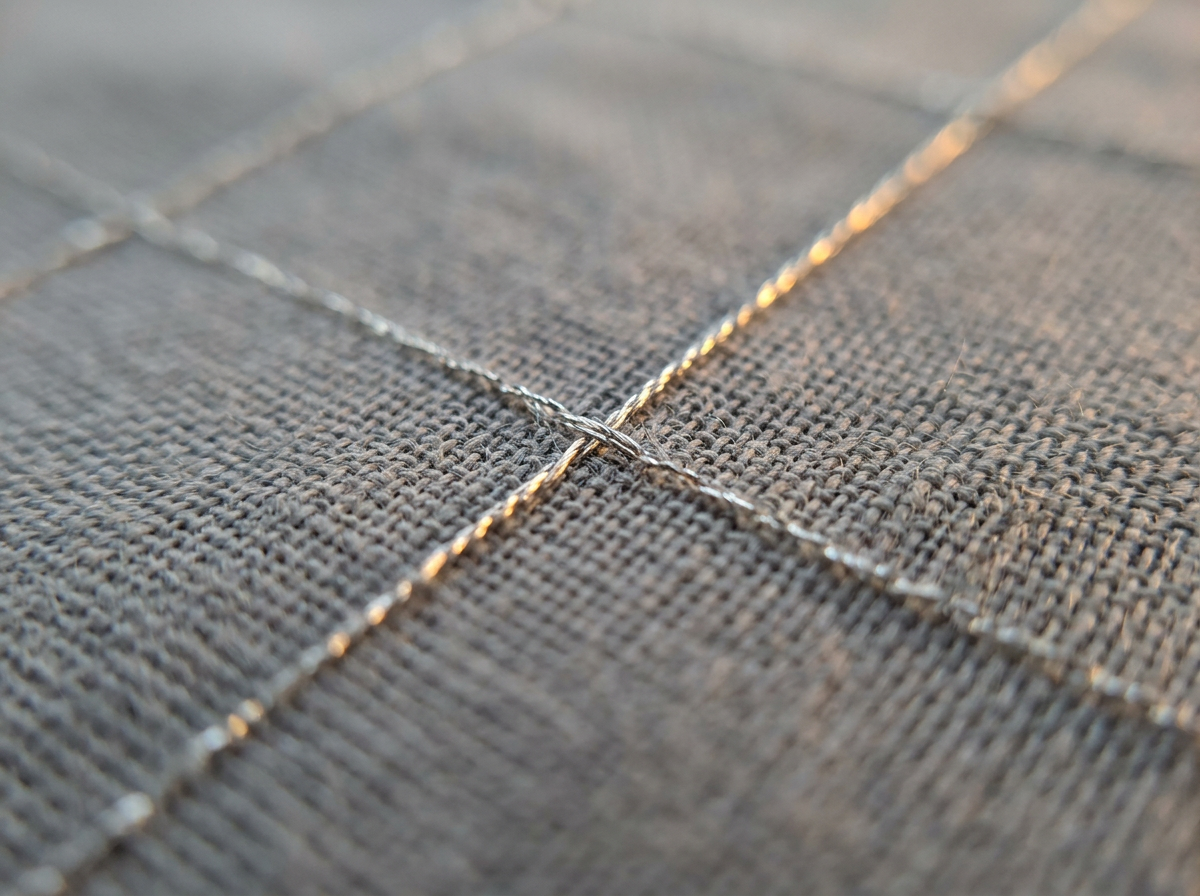 Macro of the silver conductive thread grid