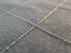 Macro of the silver conductive thread grid in the TELLUS sheet