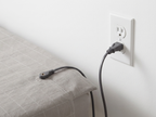 TELLUS snap connector cord plugged into the outlet ground port